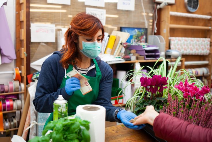 florist receives a payment from a customer