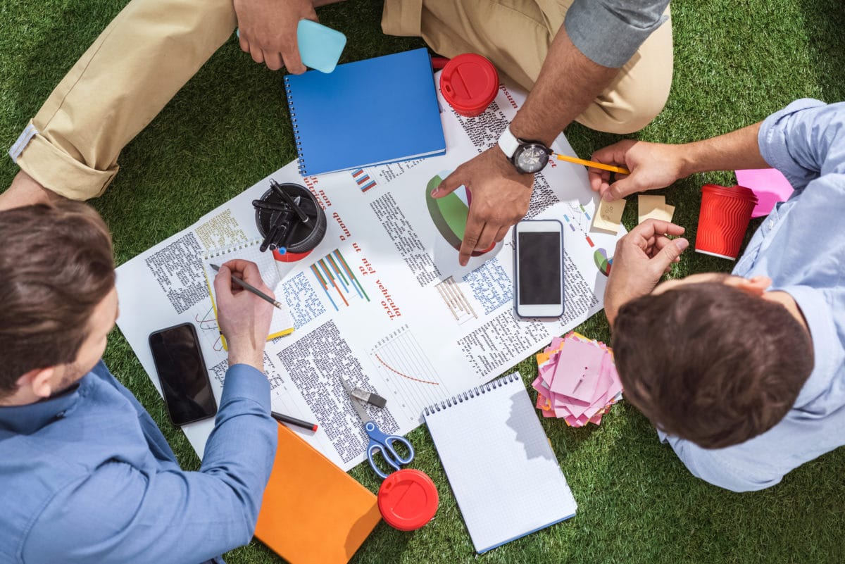 Overhead View Of Business People Working On New Business Plan, Business Teamwork